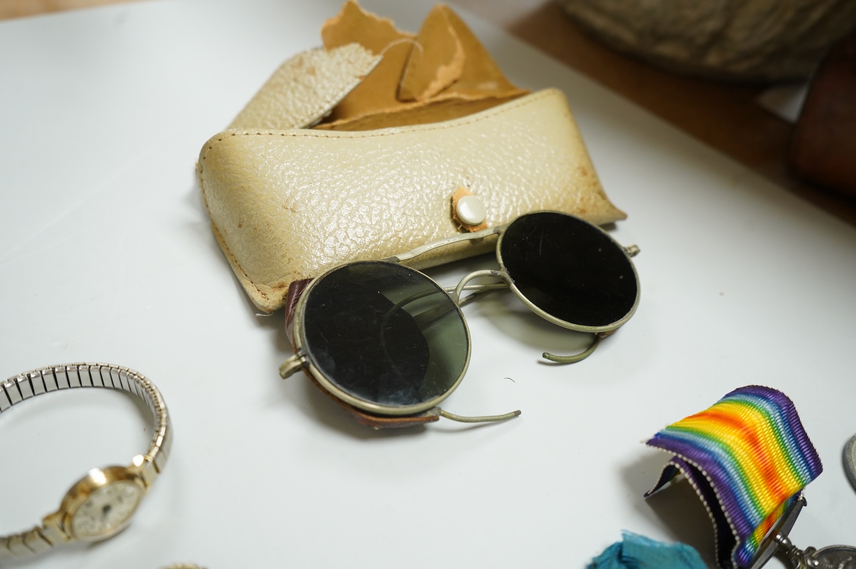 Assorted collectables including medals, aviator's glasses and costume jewellery and an antique seal